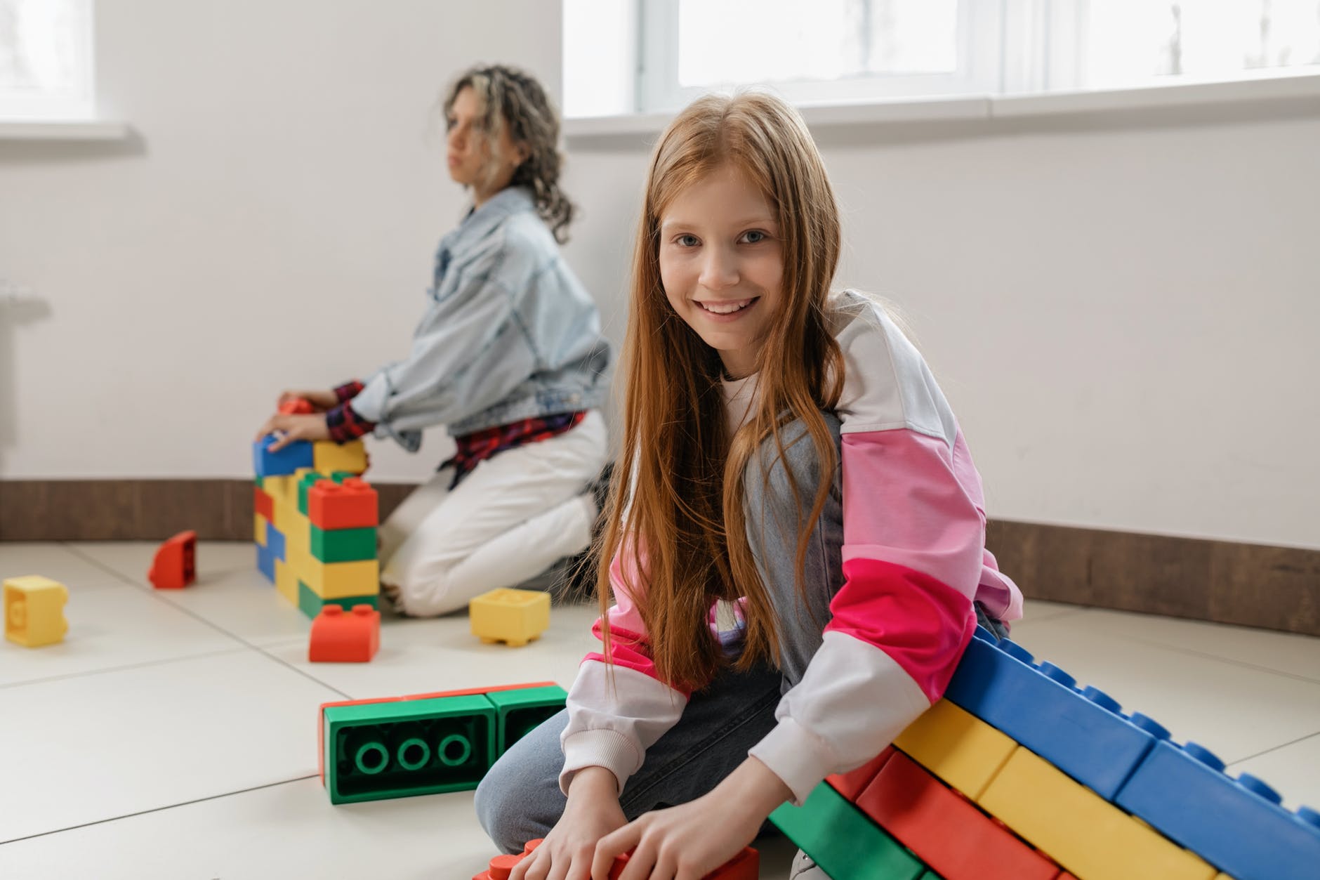 children playing with giant lego blocks